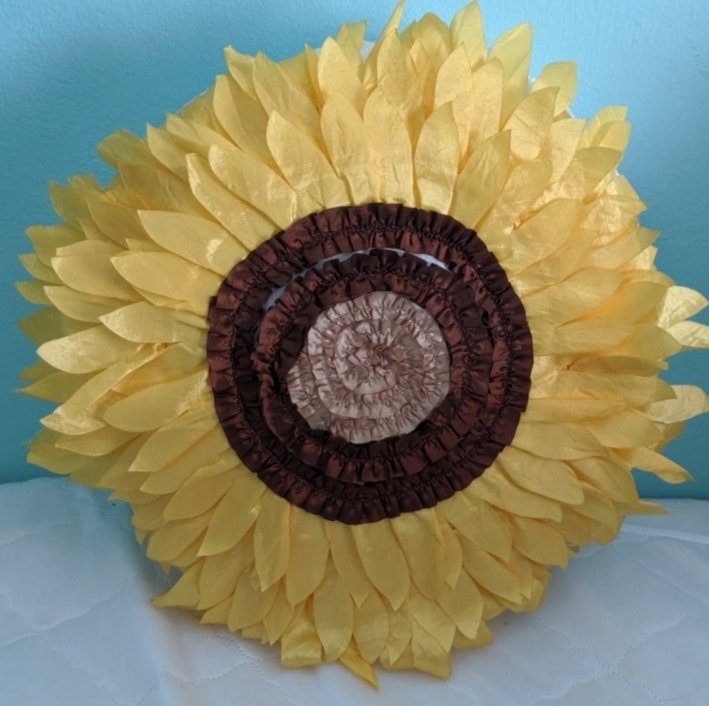 Accent pillow shaped like a sunflower